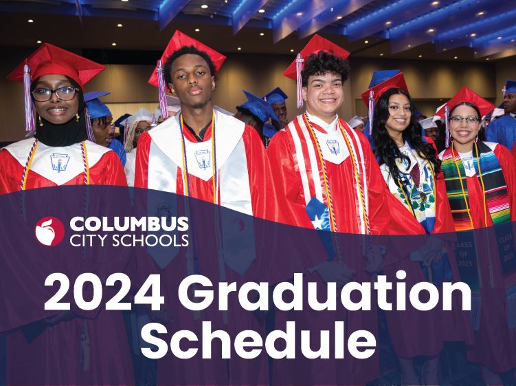 Students standing in graduation gaps and gowns